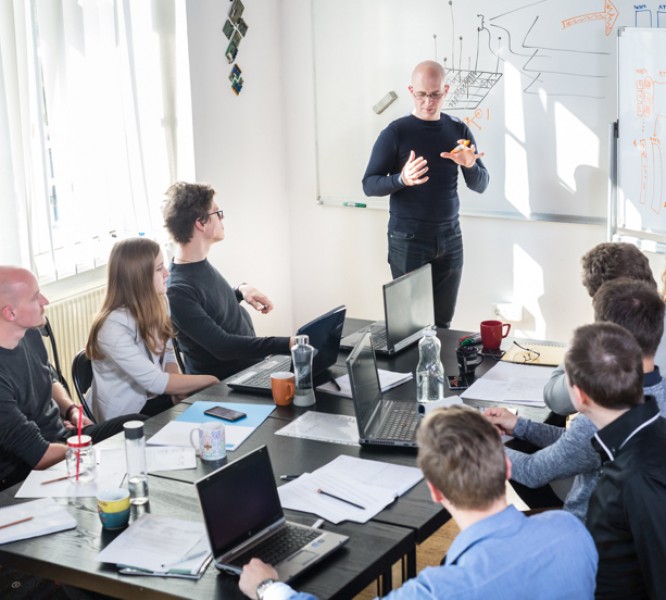 Several workers in an office meeting